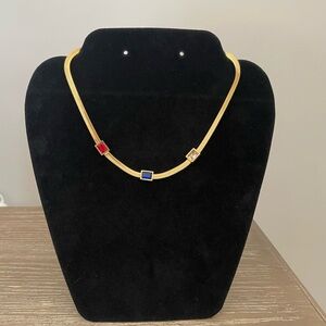 Elegant Gold Necklace with Red and Blue Accents